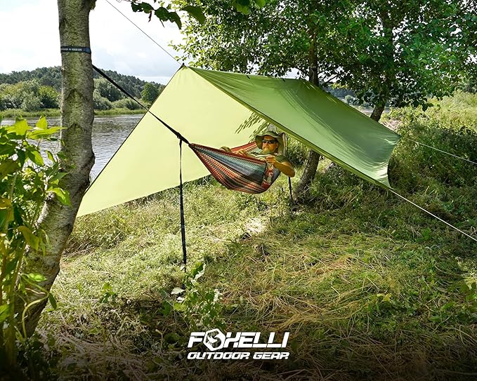 Foxelli Camping Tarp - 12x10ft Waterproof Rain Tarp, Lightweight Backpacking Rainfly Shelter with Included Extra Long Guy Lines & Stakes