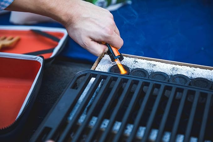 Fire & Flavor Hero Grill System - Ultra-Portable Grill for Camping, Tailgating, and BBQ on the Go - Tabletop Charcoal Grill Set Comes with Spatula, Thermometer, and Cutting Board